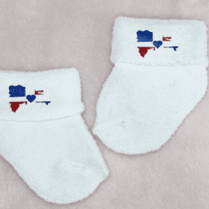 Baby socks with the Dominican Republic flag shaped like the Island of the Dominican Republic. There is a blue heart in the center where the crest would normally be.