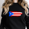 woman wearing a black crewneck sweatshirt with the puerto rican flag in the shape of the island of puerto rico.
