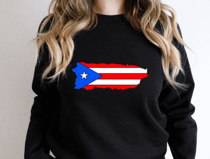 woman wearing a black crewneck sweatshirt with the puerto rican flag in the shape of the island of puerto rico.