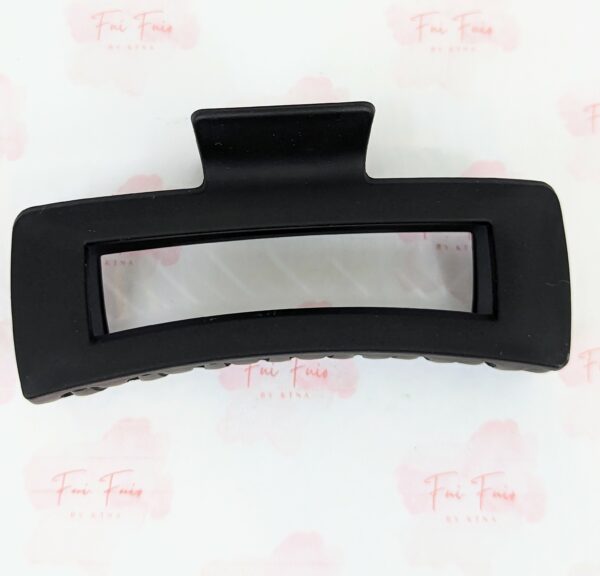 Black XL Claw Hair Clip with hollow center on branded paper that says Fui Fuio by Ktna