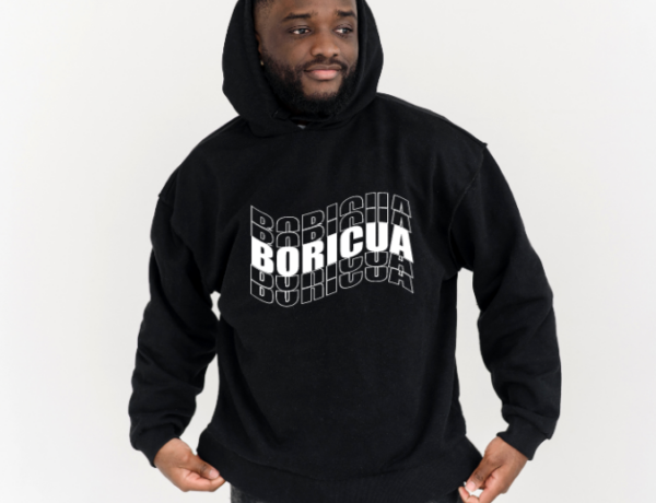 man wearing a black hoodie with the word Boricua echoed written in wavy font in white.
