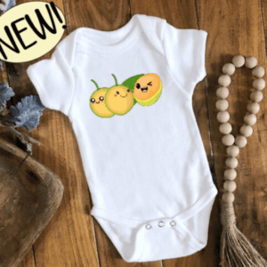 White baby bodysuit with a group of 3 quenepas with little kawaii faces.