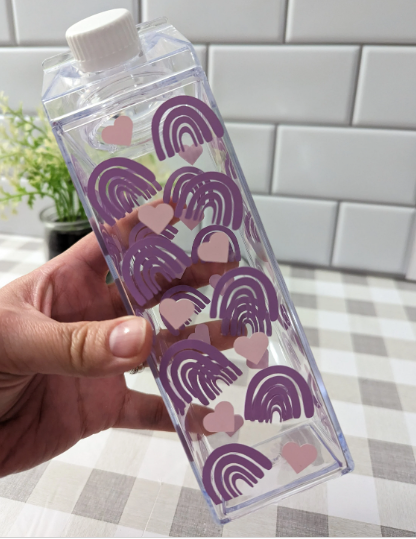 Clear milk carton water bottle with lavender rainbows and pink hearts