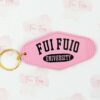 Pink Motel Keychain with gold tone ring. Phrase "Fui Fuio University" written on both sides in black.