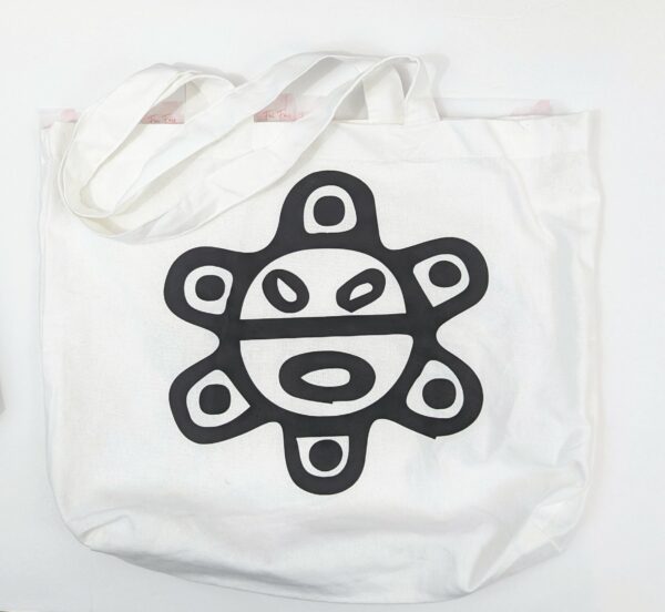 White Cotton Tote bag with the Taino Sun on one side and the word Taino on the other side.