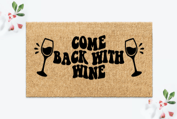 Custom Coir Doormat with the funny phrase "Come Back With Wine" in a wavy retro text and a wine glass on each side.