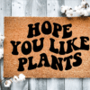 Coir Doormat with the funny phrase "Hope you like plants" written in a wavy retro font.