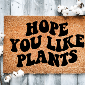 Coir Doormat with the funny phrase "Hope you like plants" written in a wavy retro font.