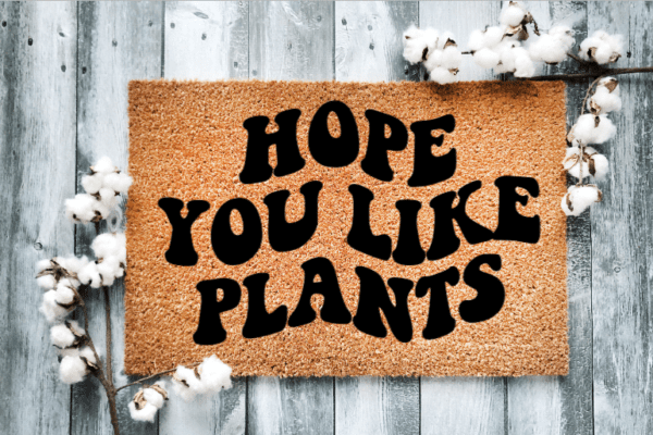 Coir Doormat with the funny phrase "Hope you like plants" written in a wavy retro font.