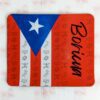 Mouse pad with the Puerto Rican Flag. The right side of the flag has a larger red size with the word "Boricua" written on it. There are Taino Petroglyphs over the entire mouse pad.